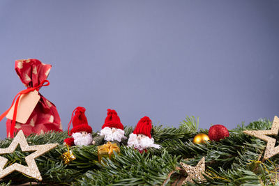 Close-up of christmas decorations against clear sky