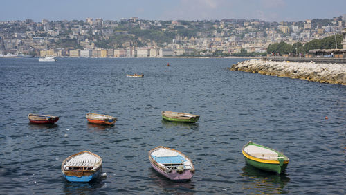 High angle view of sea by city