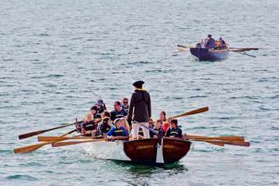 People in boat on sea