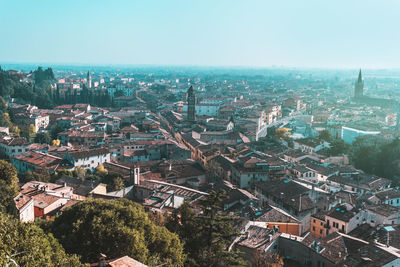 Blue hours in verona city centre, italy. panoramic view from above on streets and adige river