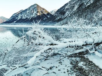 Scenic view of snow covered mountains against sky