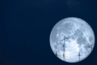 Low angle view of moon in sky at night