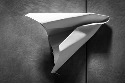High angle view of white paper on wall