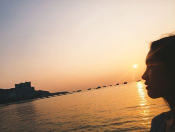 Scenic view of sea against clear sky during sunset