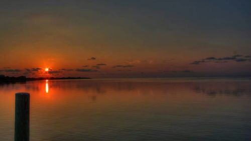 Scenic view of sunset over sea