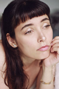 Close-up portrait of a smiling young woman