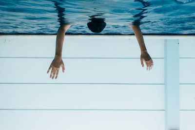 Low section of woman standing on tiled floor