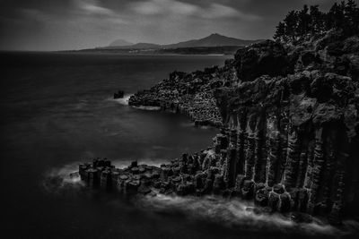 Panoramic shot of sea and buildings against sky