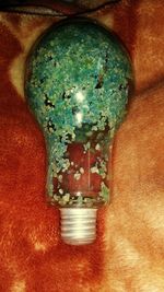 Close-up of illuminated light bulb