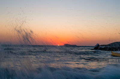 Scenic view of sea against sky during sunset