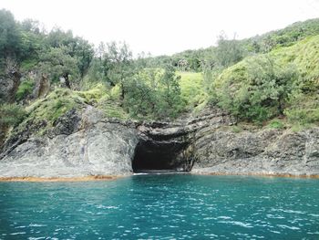 Scenic view of rocks by sea