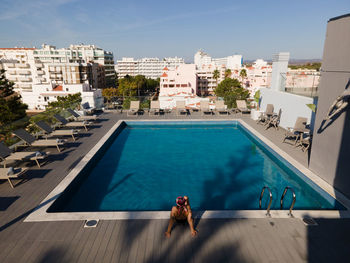 High angle view of swimming pool in city