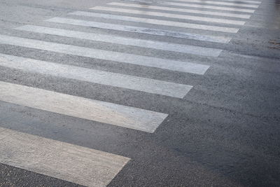 High angle view of road sign on street