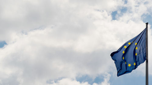 Low angle view of flag against sky