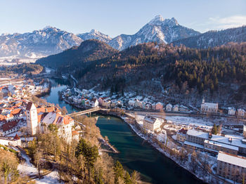 Aerial view of füssen and mountains against sky