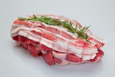 Close-up of meat against white background