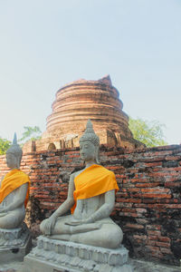 Statue of buddha against sky