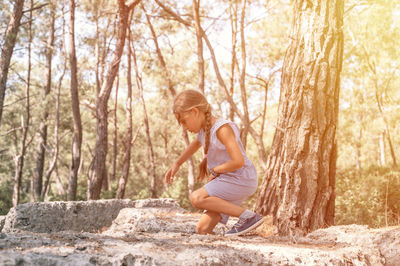 23.07.2021 turkey, kemer kid girl traveler of eight years old explore ancient excavations of ruins