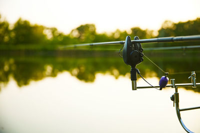 Low angle view of man standing by lake