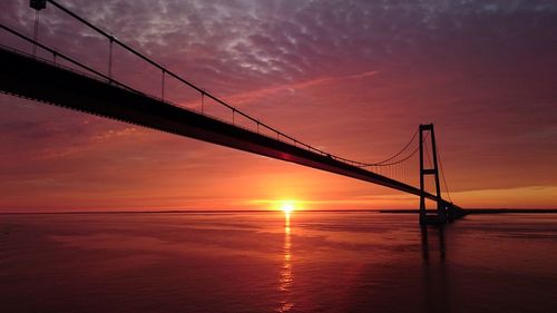 View of suspension bridge at sunset