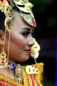 Young woman wearing headdress during festival