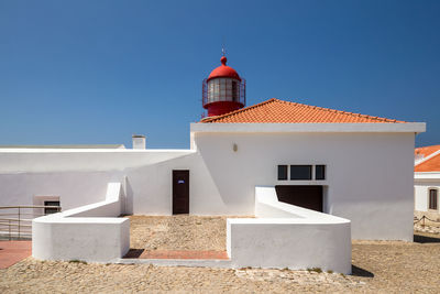 Low angle view of building against clear blue sky