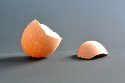 Close-up of orange fruit against white background