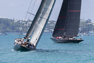 Boat sailing on sea against sky