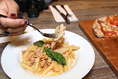 Midsection of person preparing food on table