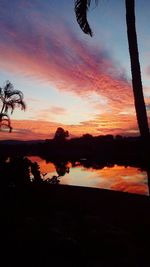 Reflection of clouds in water at sunset