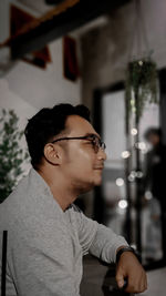 Portrait of young man looking away