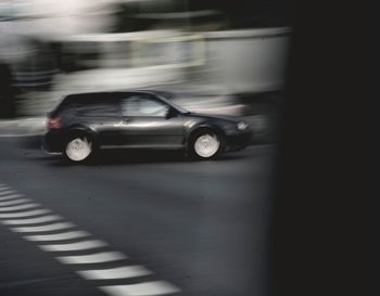 Blurred motion of car on road