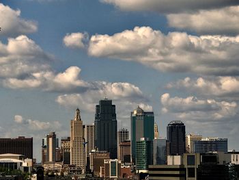 Modern buildings in city against sky