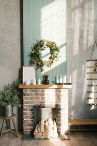 Modern christmas interior with decorative brick fireplace, scandinavian style