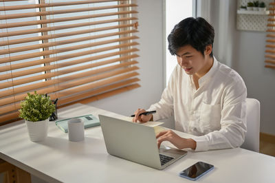 Doctor examining patient at home