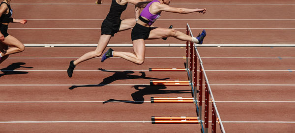 Low section of woman jumping