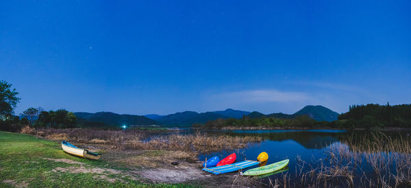 Scenic view of lake against blue sky