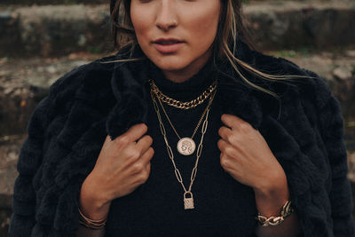 Portrait of woman wearing hat standing outdoors