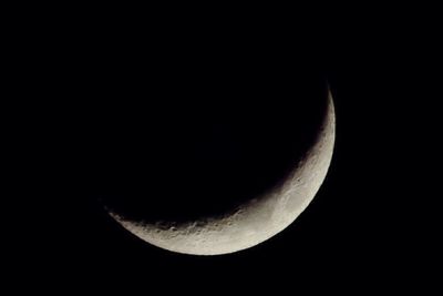 Close-up of moon over black background