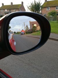 Reflection of car on side-view mirror