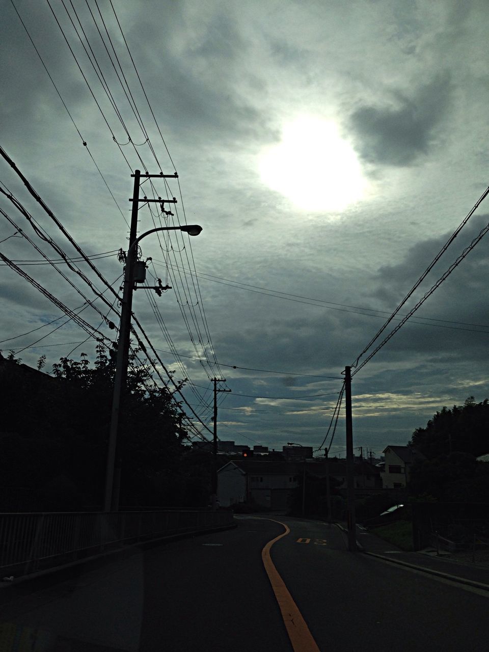 electricity pylon, power line, electricity, power supply, sky, cable, fuel and power generation, connection, cloud - sky, transportation, power cable, technology, cloudy, road, silhouette, street light, the way forward, low angle view, sunset, street