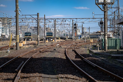 Train on railroad track against sky