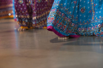 Low section of woman standing on floor