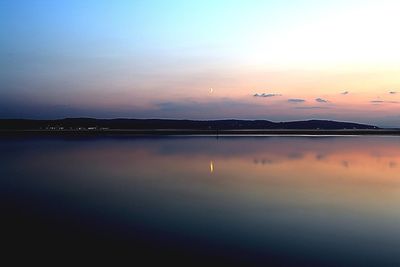 Scenic view of sunset over river