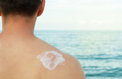 Rear view of man on beach