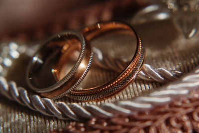 Close-up of wedding rings on table