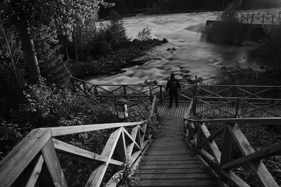 People walking on footbridge