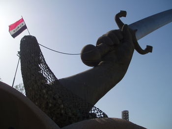 Low angle view of statue against sky