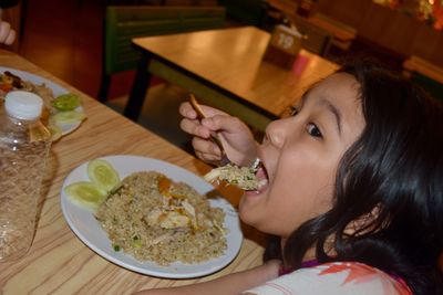 Portrait of woman eating food