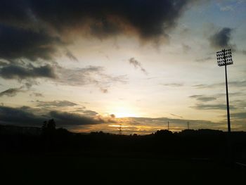 Silhouette landscape against sky during sunset